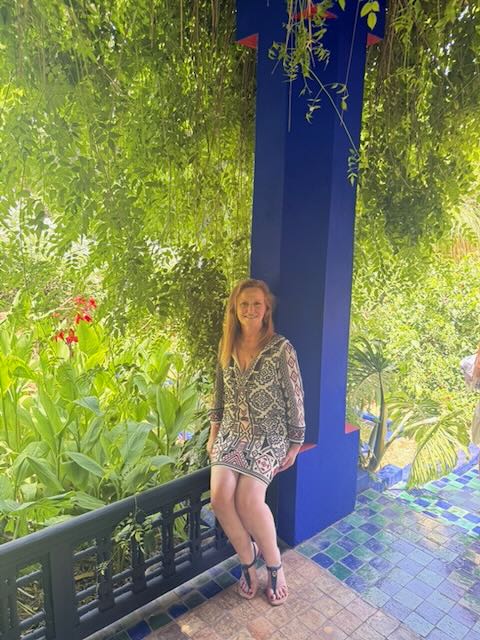 Laura Thatcher wearing one of her planned travel outfits at Jardin Majorelle in Marrakech, Morocco.